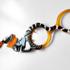 COLGANTE-GAFAS GATO WARHOL NARANJA - EDICIÓN 15 AÑOS